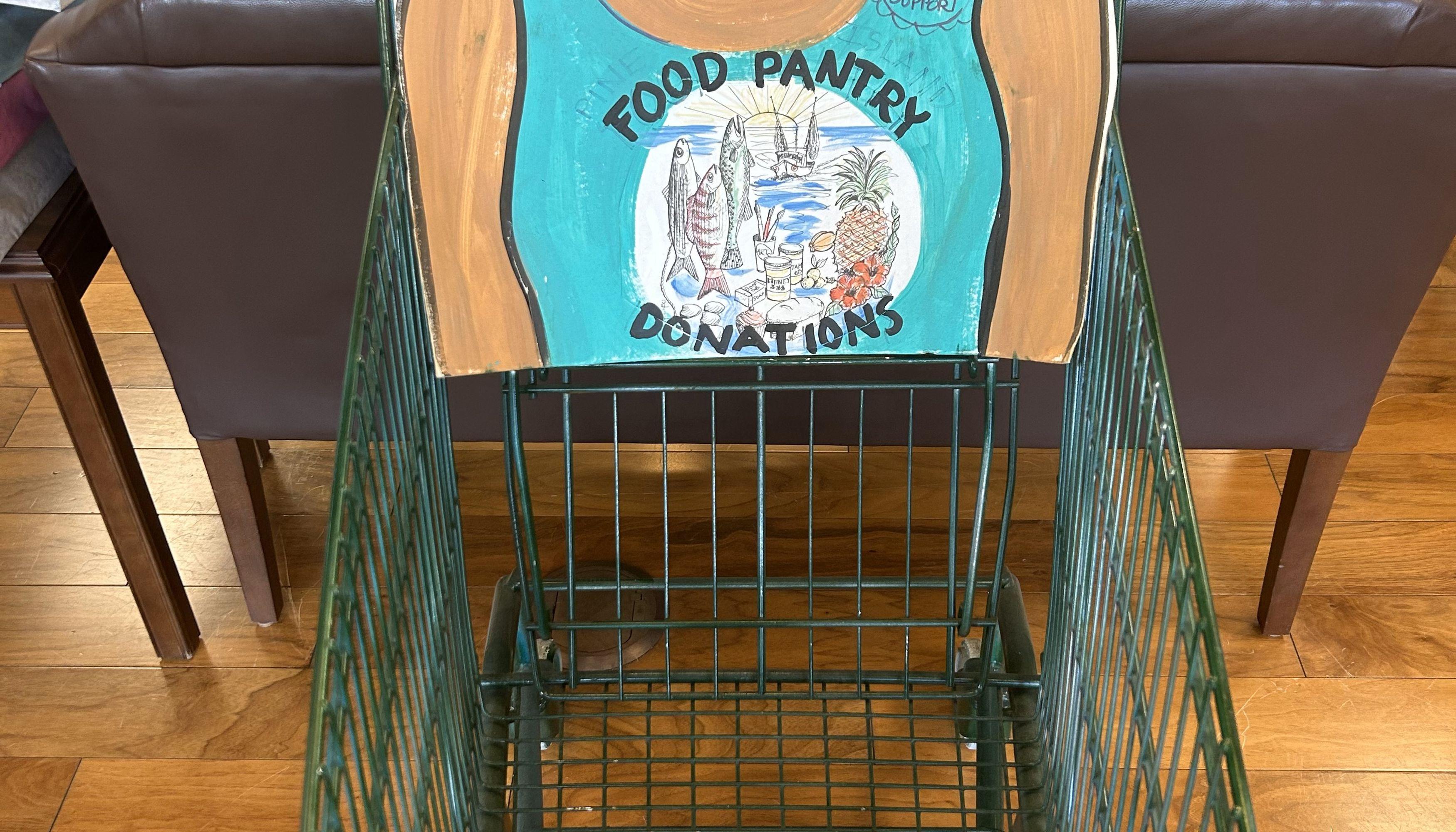 The stock the box donation cart with hand made poster.